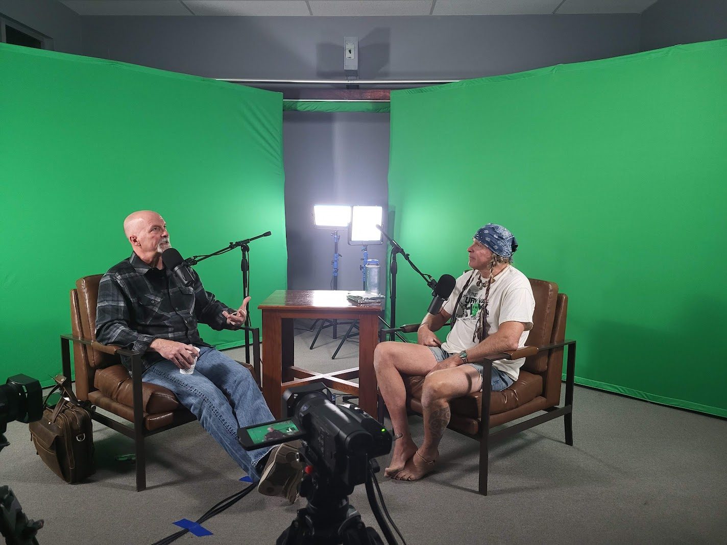 Two people recording a podcast interview on camera in the CAST11.com studio